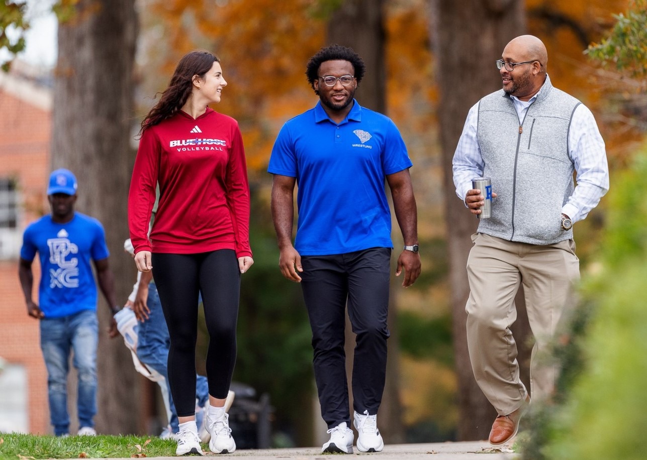 students walking with professor